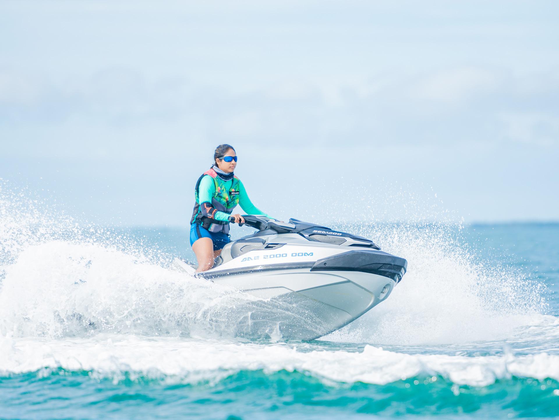 A girl riding a SeaDoo jetski by Debug Auto Exclusive. SeaDoo Sri Lanka. D.E.A