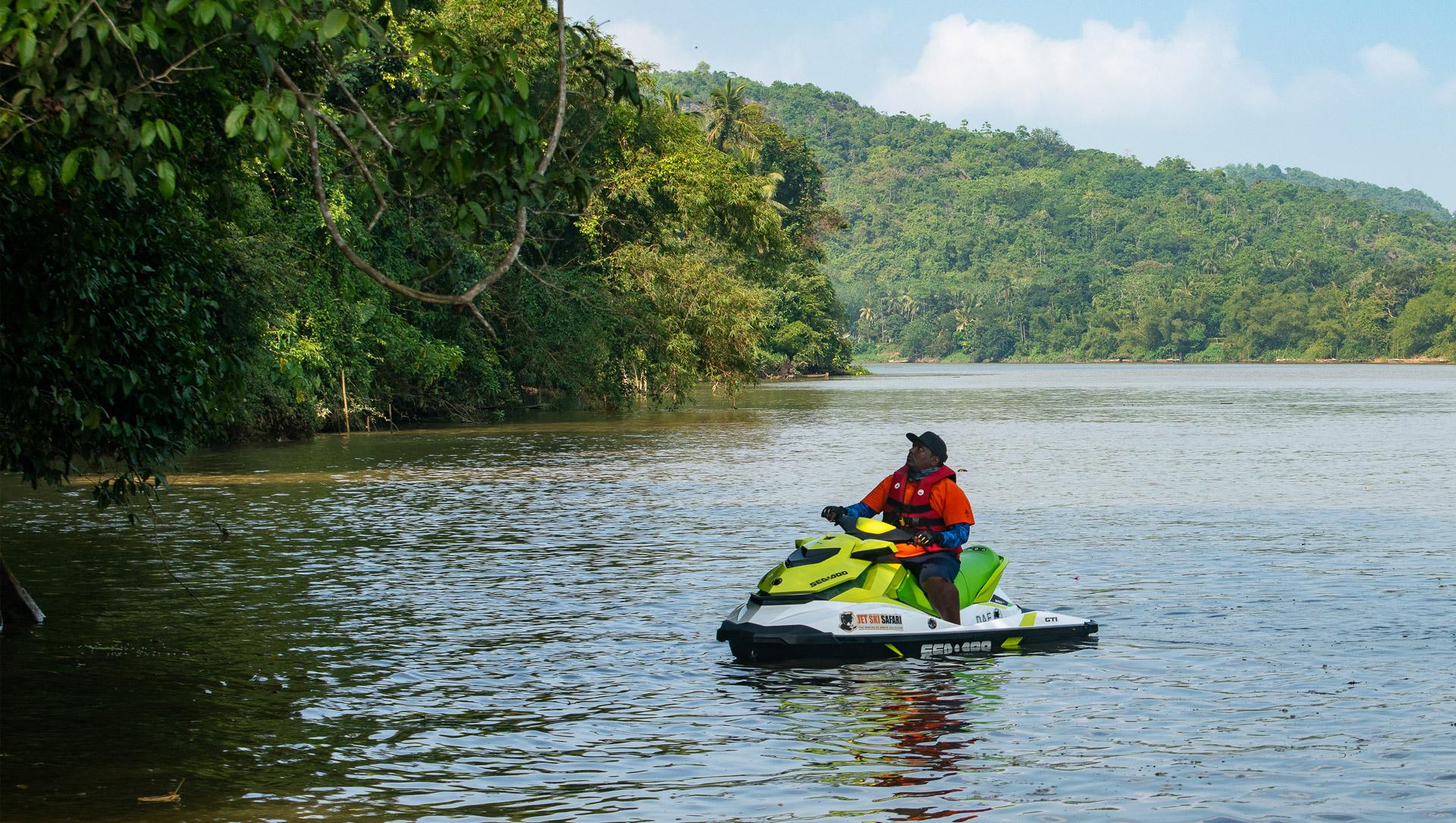 A person riding a Sea-Doo jetski while in a safari with Debug Auto Exclusive