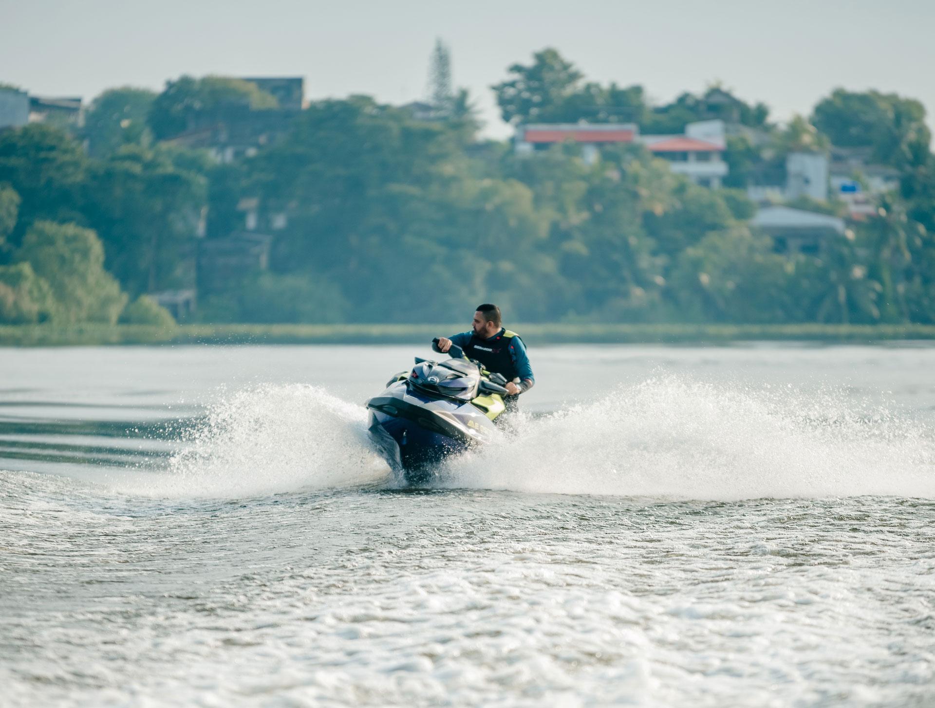 A person riding a jetski in south bolgoda lake